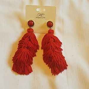 Red tussle earrings.